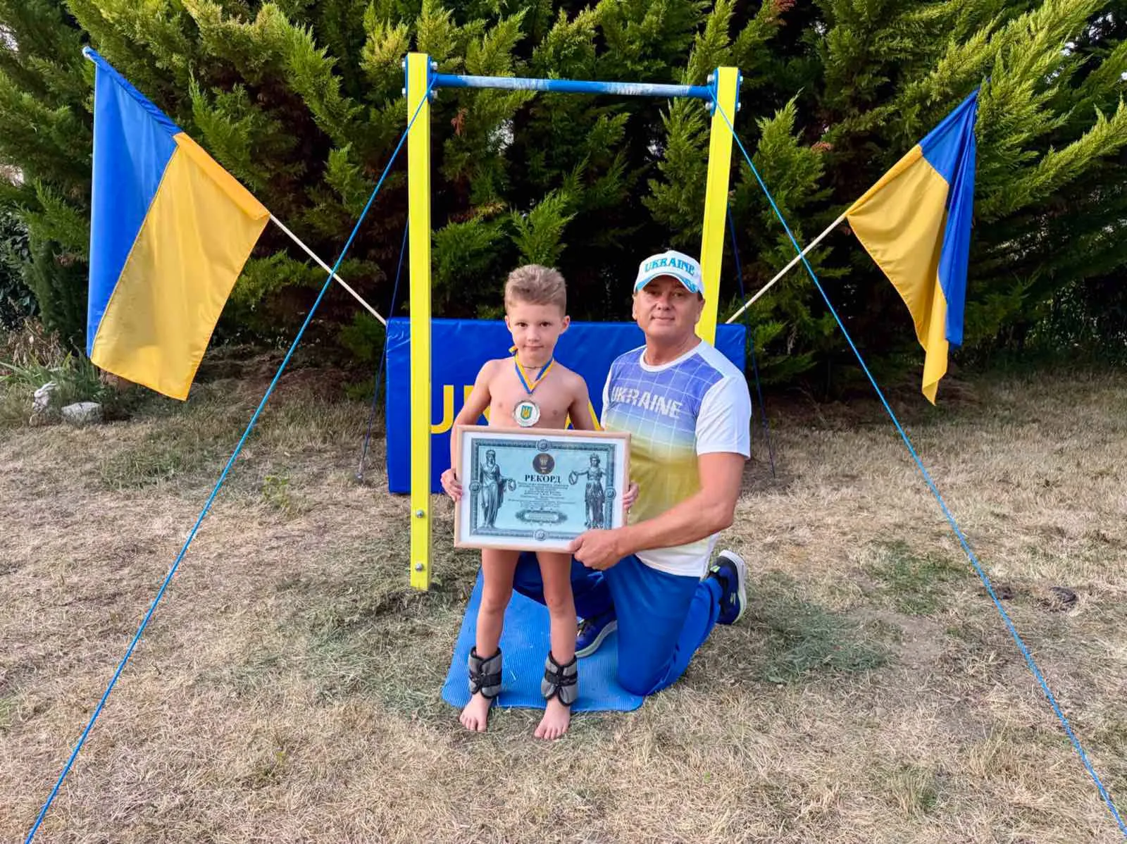 741464483_1410186647831064_887417137650624654_n Найбільша кількість повторів вправи підйом переворотом на перекладині з додатковою вагою дитиною у 7 років
